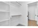 Well-organized walk-in closet with shelving and rod hanging space at 604 E Pope St, Dunn, NC 28334