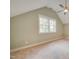 Bedroom with carpet flooring, neutral walls, ceiling fan, and windows offering nice views at 608 Hemlock Ave, Durham, NC 27707