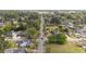 Wide aerial view of neighborhood with tree lined streets and well maintained lawns at 609 W Main St, Benson, NC 27504