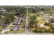 Extended view of a residential street featuring tree canopies and tidy front lawns at 609 W Main St, Benson, NC 27504