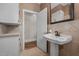 Bathroom featuring a pedestal sink and tiled floor at 609 W Main St, Benson, NC 27504