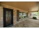 Charming front porch with a decorative glass front door and stone accents at 609 W Main St, Benson, NC 27504