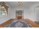Bright living room featuring hardwood floors and open access to adjoining rooms at 609 W Main St, Benson, NC 27504