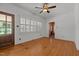 Spacious living room with wood floors and plenty of natural light from a window at 609 W Main St, Benson, NC 27504