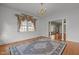 Spacious living room with hardwood floors and open access to adjoining rooms at 609 W Main St, Benson, NC 27504