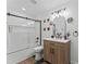 Charming bathroom with modern fixtures, stylish lighting, and a shower with glass doors at 711 Horton Rd, Durham, NC 27704