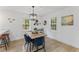 Cozy dining room with modern light fixture and natural light at 711 Horton Rd, Durham, NC 27704