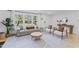 Spacious living room with hardwood floors, ample natural light, and stylish furnishings at 711 Horton Rd, Durham, NC 27704