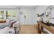 Bright living room with hardwood floors, featuring large windows and stylish decor at 711 Horton Rd, Durham, NC 27704