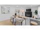 Open-concept living room with a fireplace, hardwood floors, and modern furnishings at 711 Horton Rd, Durham, NC 27704