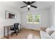 Bright office with a wooden desk, comfortable seating, and a large window with natural light at 711 Horton Rd, Durham, NC 27704