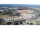 Aerial view of a community with newly-constructed single-Gathering homes, roads, and green spaces at 7385 Pilatus Ave, Spring Hope, NC 27882