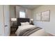 Comfortable secondary bedroom with plush carpet, a modern headboard and natural light at 7385 Pilatus Ave, Spring Hope, NC 27882