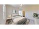 Serene bedroom with a large window, neutral tones, and a view to the ensuite bathroom at 7385 Pilatus Ave, Spring Hope, NC 27882