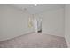 Spacious bedroom with neutral carpet, white walls, and an ensuite bathroom entrance at 7385 Pilatus Ave, Spring Hope, NC 27882