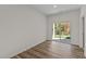 Bright bedroom with hardwood floors and a sliding glass door to the backyard at 7385 Pilatus Ave, Spring Hope, NC 27882