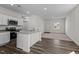 Modern kitchen with an island, stainless steel appliances, and open to the living area at 7385 Pilatus Ave, Spring Hope, NC 27882