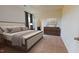 Stylish main bedroom featuring a neutral color scheme and plush carpet flooring at 7385 Pilatus Ave, Spring Hope, NC 27882