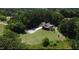 Expansive property showcases a well-maintained home and lush surrounding greenery, blending privacy with natural beauty at 93 Clifton Pond Rd, Louisburg, NC 27549