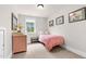 This bedroom features one twin bed and a desk at 93 Clifton Pond Rd, Louisburg, NC 27549