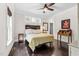 Elegant bedroom with hardwood floors, refined decor, and natural light, offering a comfortable and stylish retreat at 93 Clifton Pond Rd, Louisburg, NC 27549
