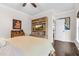 Bright bedroom with hardwood floors, stylish furniture, and tasteful decor, providing a comfortable and inviting space at 93 Clifton Pond Rd, Louisburg, NC 27549