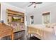 Comfortable bedroom with hardwood floors, built-in shelving, and views of nature, creating a serene atmosphere at 93 Clifton Pond Rd, Louisburg, NC 27549