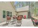 Outdoor deck space with wicker chairs and table for outdoor dining at 93 Clifton Pond Rd, Louisburg, NC 27549
