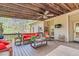 Relaxing outdoor living space with stylish seating and wooded views at 93 Clifton Pond Rd, Louisburg, NC 27549