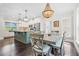 Charming dining area adjacent to the kitchen, featuring a large window and elegant lighting at 93 Clifton Pond Rd, Louisburg, NC 27549