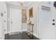 Inviting entryway features dark wood floors, neutral walls, and charming decor at 93 Clifton Pond Rd, Louisburg, NC 27549