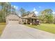 Charming home with attached garage, well-manicured lawn, and inviting front porch at 93 Clifton Pond Rd, Louisburg, NC 27549