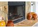 Close-up of a stone fireplace with decorative urns on the hearth at 93 Clifton Pond Rd, Louisburg, NC 27549