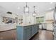 Kitchen island features a granite countertop, storage, and stylish pendant lighting at 93 Clifton Pond Rd, Louisburg, NC 27549