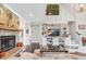 Comfortable living area showcasing a stone fireplace and built-in shelving at 93 Clifton Pond Rd, Louisburg, NC 27549