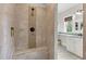 Walk-in shower with tile surround, built-in seat, and overhead shower head at 93 Clifton Pond Rd, Louisburg, NC 27549