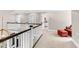 Bright upstairs landing featuring carpet flooring and a sitting area at 93 Clifton Pond Rd, Louisburg, NC 27549