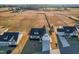 An aerial view of multiple homes and large grassy lots with potential for farming or recreational activities at 95 Watermeadow Dr, Clayton, NC 27520