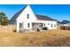 Spacious backyard features a screened in porch with outdoor furniture and a well-maintained lawn at 95 Watermeadow Dr, Clayton, NC 27520