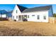 A spacious backyard features an outdoor patio with a grill and a partially screened-in porch at 95 Watermeadow Dr, Clayton, NC 27520