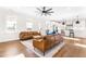 Inviting living room with hardwood floors, comfortable seating and flows seamlessly into the modern kitchen at 95 Watermeadow Dr, Clayton, NC 27520