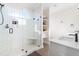 Main bathroom featuring a glass-enclosed shower with built-in seat and shelving at 95 Watermeadow Dr, Clayton, NC 27520