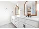 Main bathroom featuring double vanity with quartz counters, mirrors, and drawers for storage at 95 Watermeadow Dr, Clayton, NC 27520