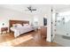 Comfortable main bedroom with hardwood floors, lots of light and walk-in shower through doorway at 95 Watermeadow Dr, Clayton, NC 27520