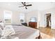Main bedroom featuring hardwood floors, natural light, and TV on a wooden dresser at 95 Watermeadow Dr, Clayton, NC 27520