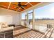 Screened porch with brick flooring, wooden ceiling, and an open doorway to a large backyard at 95 Watermeadow Dr, Clayton, NC 27520