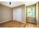 A cozy bedroom featuring hardwood floors, an interior closet and natural light from the window at 103 Windhover Dr, Chapel Hill, NC 27514