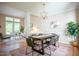 Open dining area featuring hardwood floors and views to the living room at 103 Windhover Dr, Chapel Hill, NC 27514