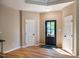 Bright foyer with hardwood floors and access to multiple rooms at 103 Windhover Dr, Chapel Hill, NC 27514