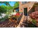 Inviting walkway leads to the front door surrounded by lush landscaping at 103 Windhover Dr, Chapel Hill, NC 27514